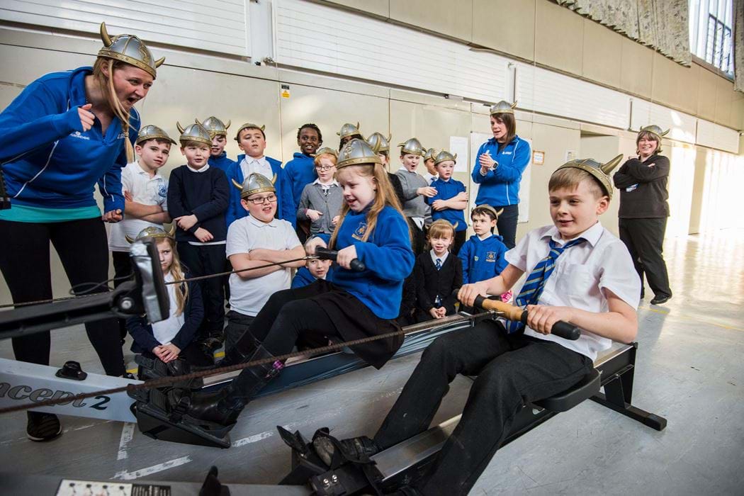 Kids in viking helmets on rowing machine