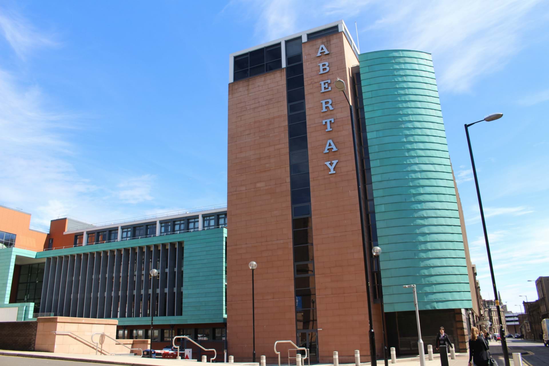 The image shows the Abertay Kydd Building on a sunny day