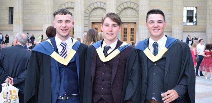 Three male graduates