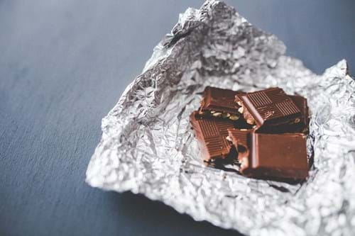 Pieces of chocolate on a foil wrapper