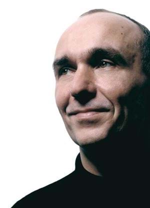 A photo of Peter Molyneux in a dark jumper