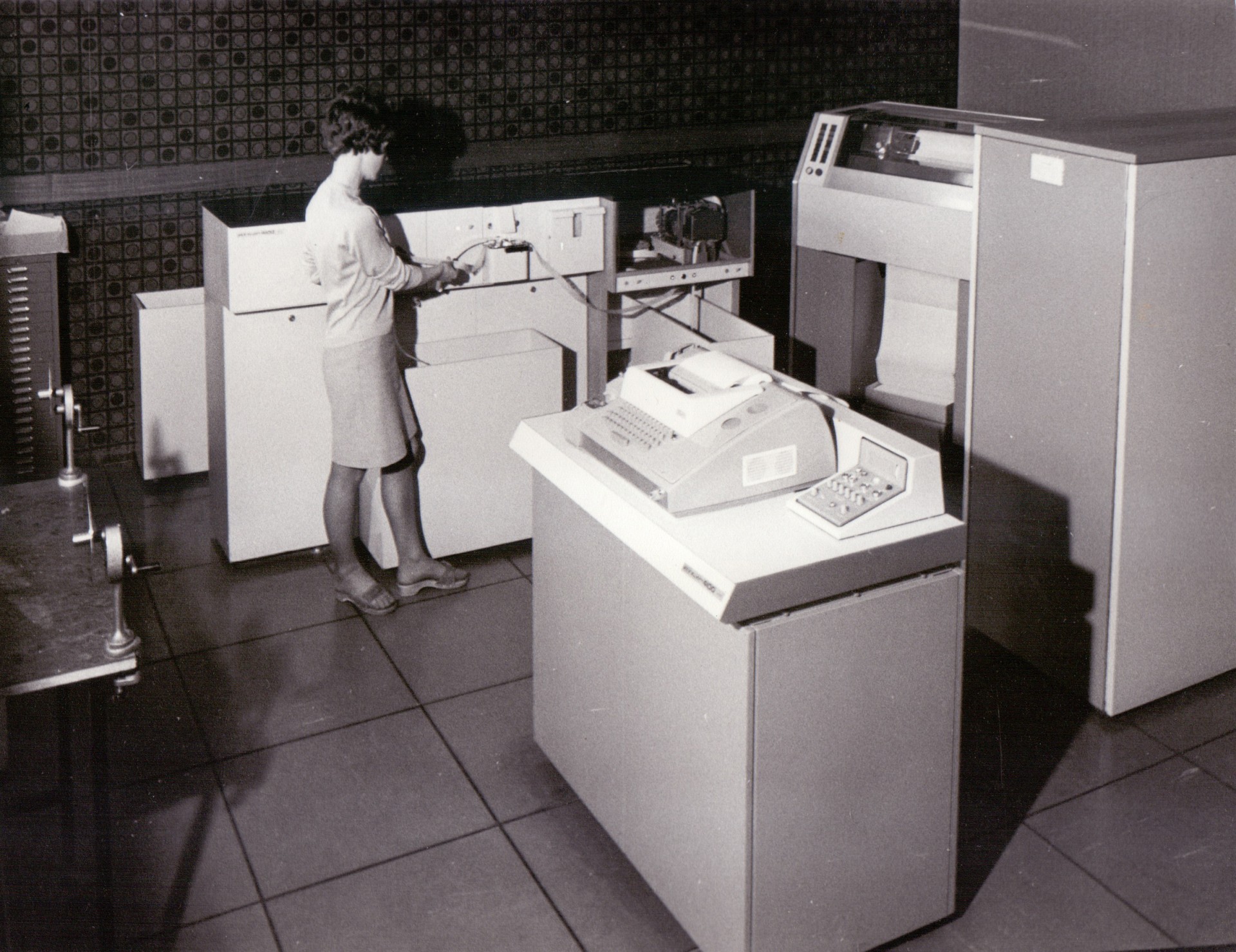 A member of staff operating an early computer