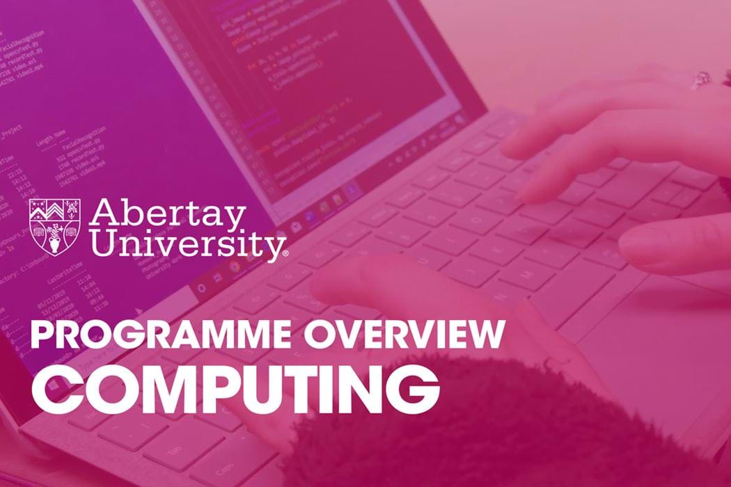 The thumbnail image for the Computing programme video is an over the shoulder of a student typing on their laptops keyboard. On the display, two woindows are open side by side, Notepad++ and PowerShell.