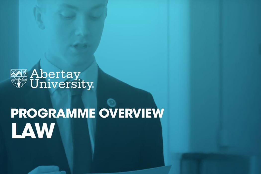 The thumbnail image for the Law programme video is of a student in a suit holding a stack of papers.