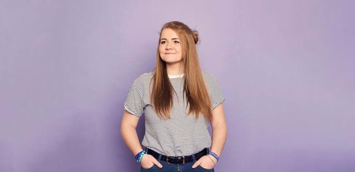 An Abertay Student on a purple coloured background