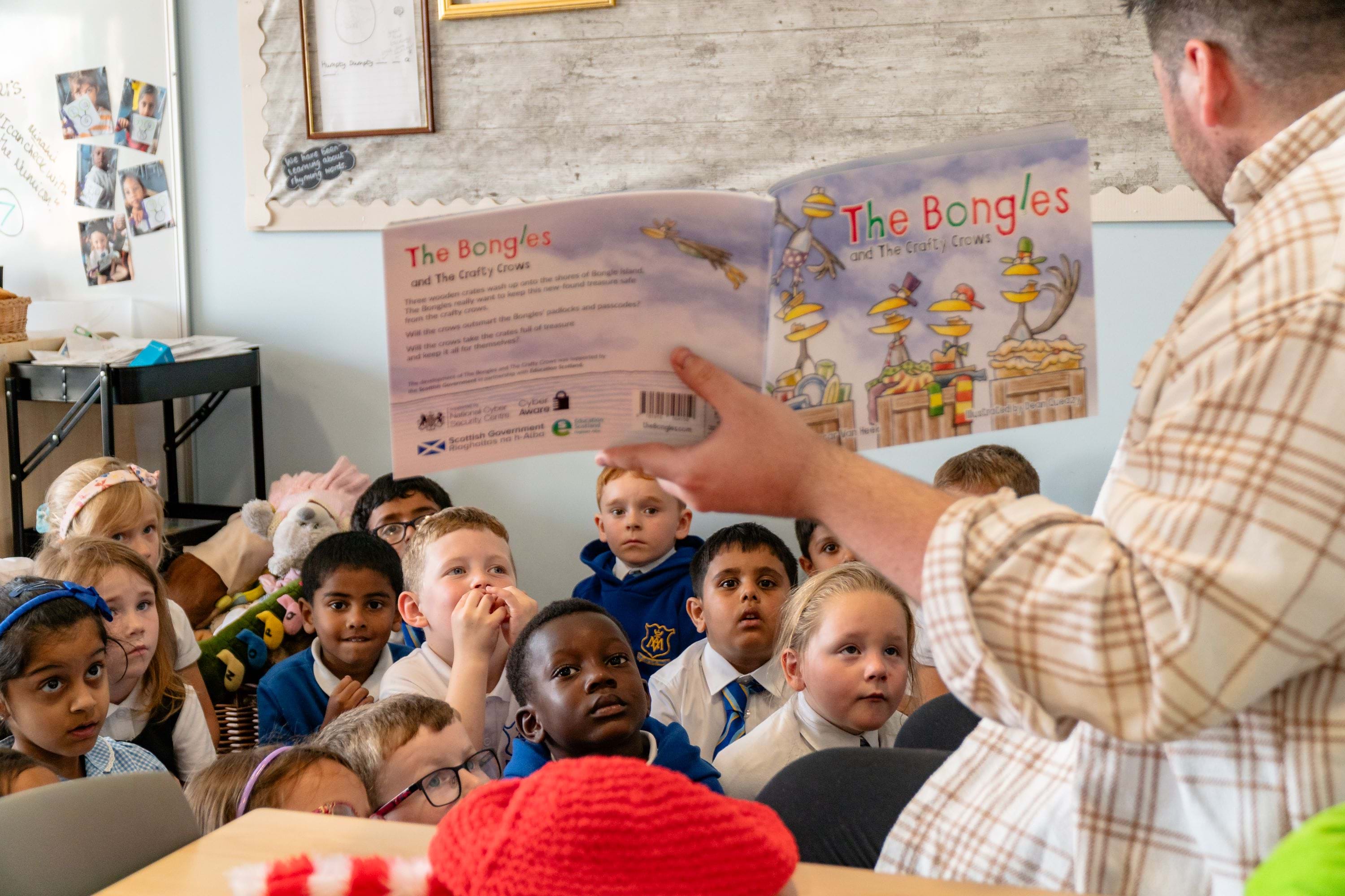 Children in a classroom listening to their teacher reading The Bongles
